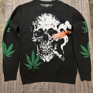 Edgy White Skull Smoking J. & Green Leaf Design on a Black Crewneck Sweater